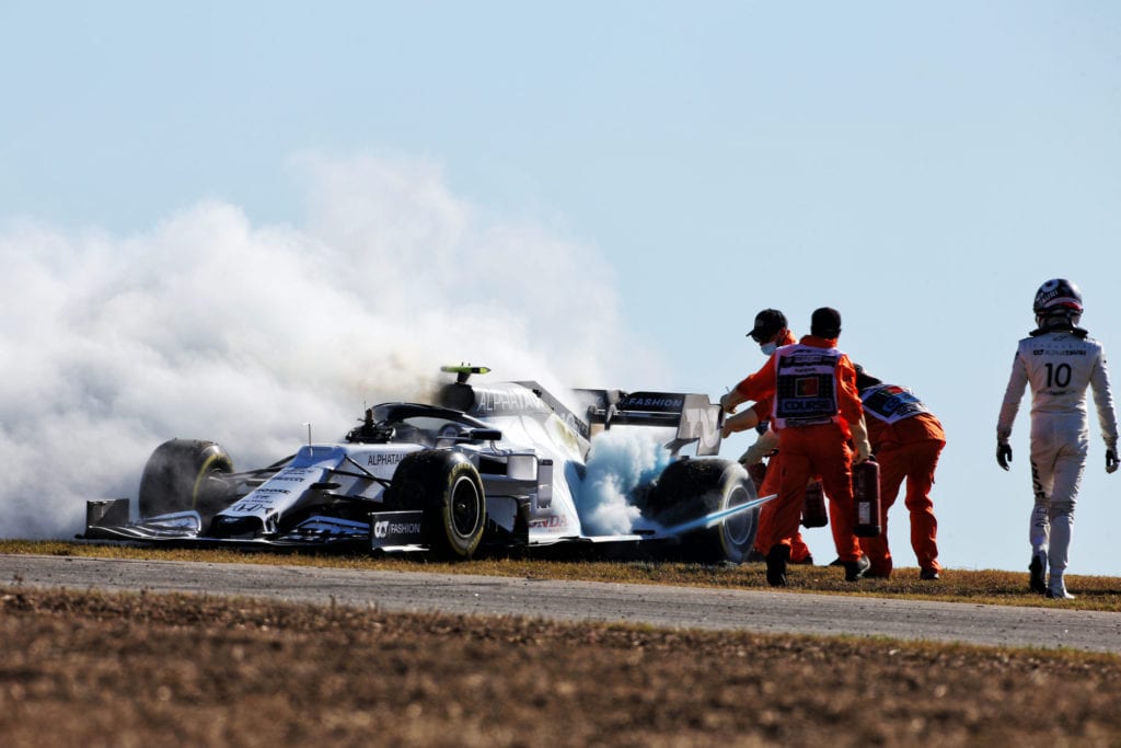 Pierre Gasly watches marshals put out the fire in his AlphaTauri © XPB Images