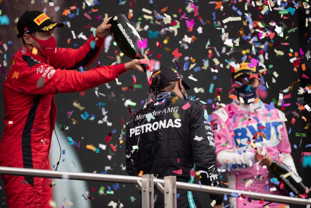 Lewis Hamilton celebrates on the podium with Sebastian Vettel and Sergio Perez © XPB Images