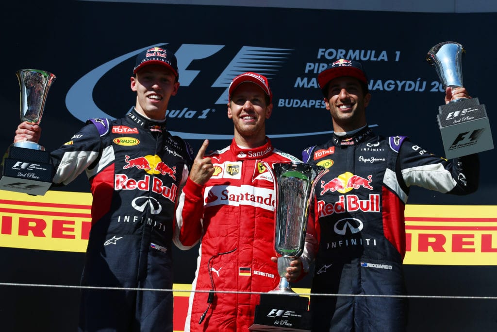 Red Bull Racing's Daniil Kvyat and Daniel Ricciardo share a podium at the 2015 Hungarian Grand Prix © XPB Images