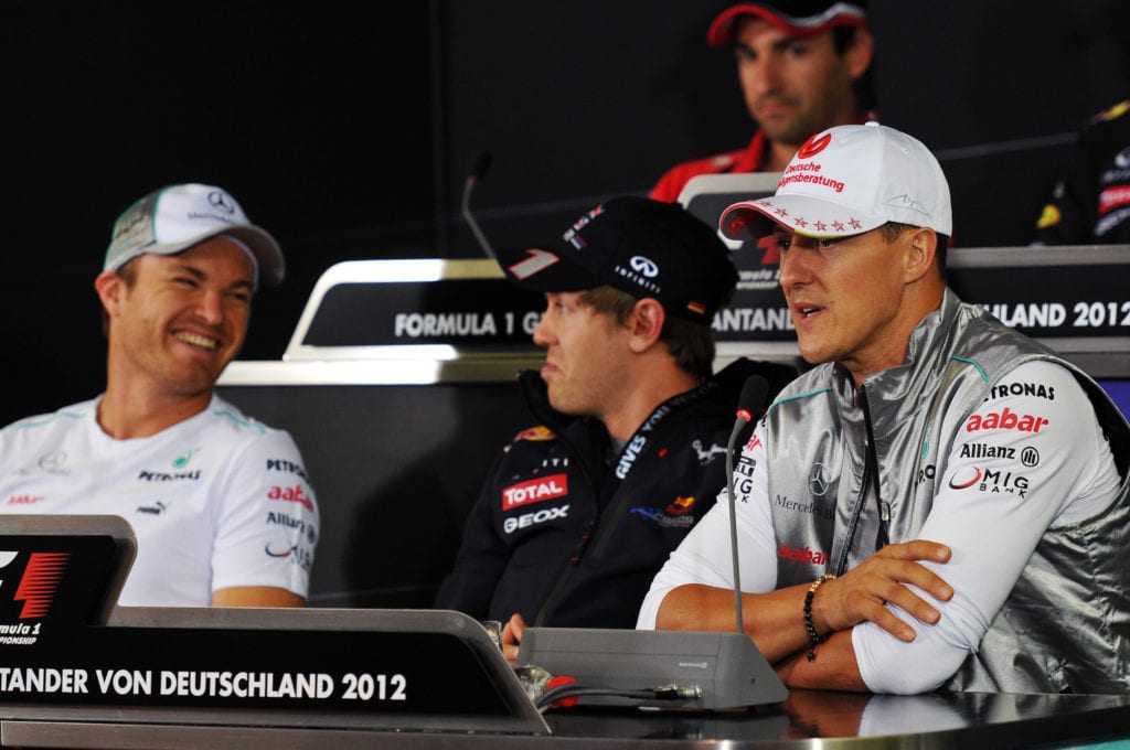 Rosberg laughs off the prank with Sebastian Vettel and Michael Schumacher © XPB Images
